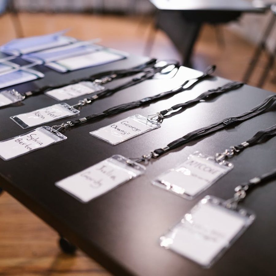 Loyalty cards and ID badges laid out on a table for travel planning