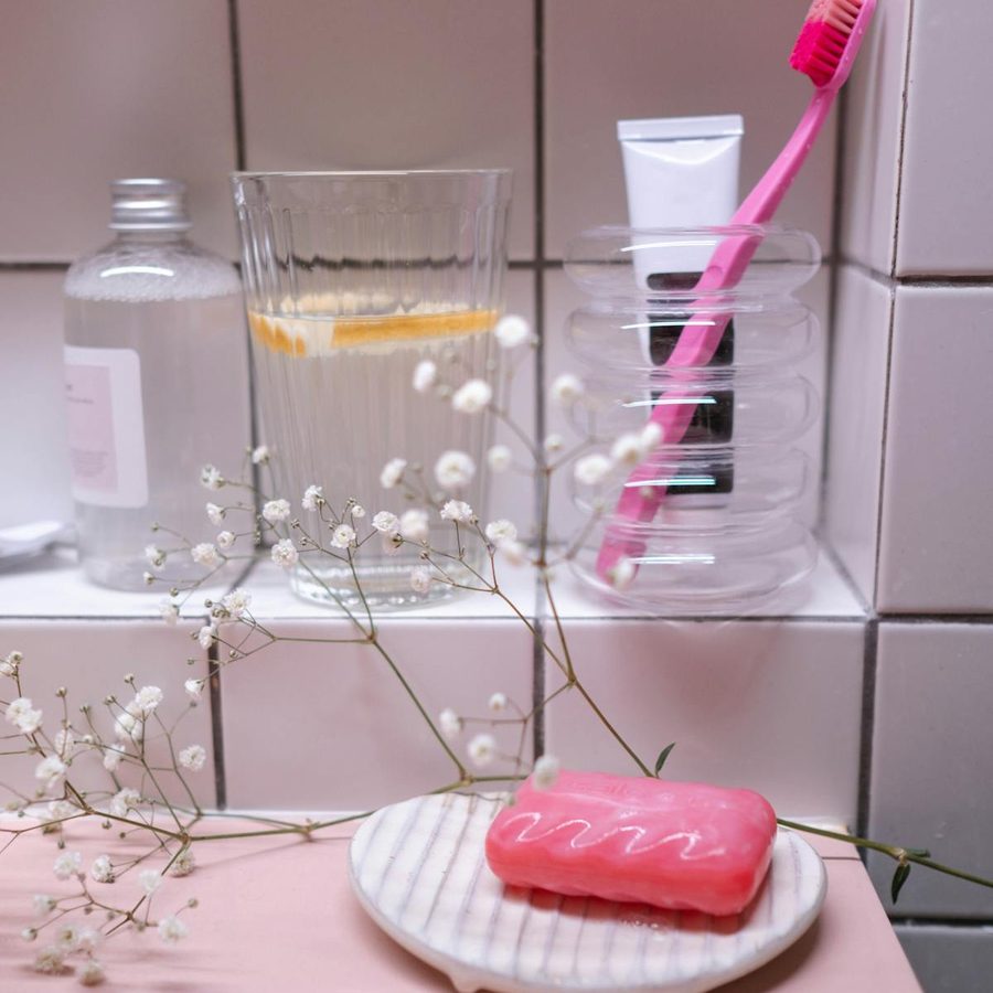 Assorted hygiene and grooming items displayed in a clean hotel bathroom